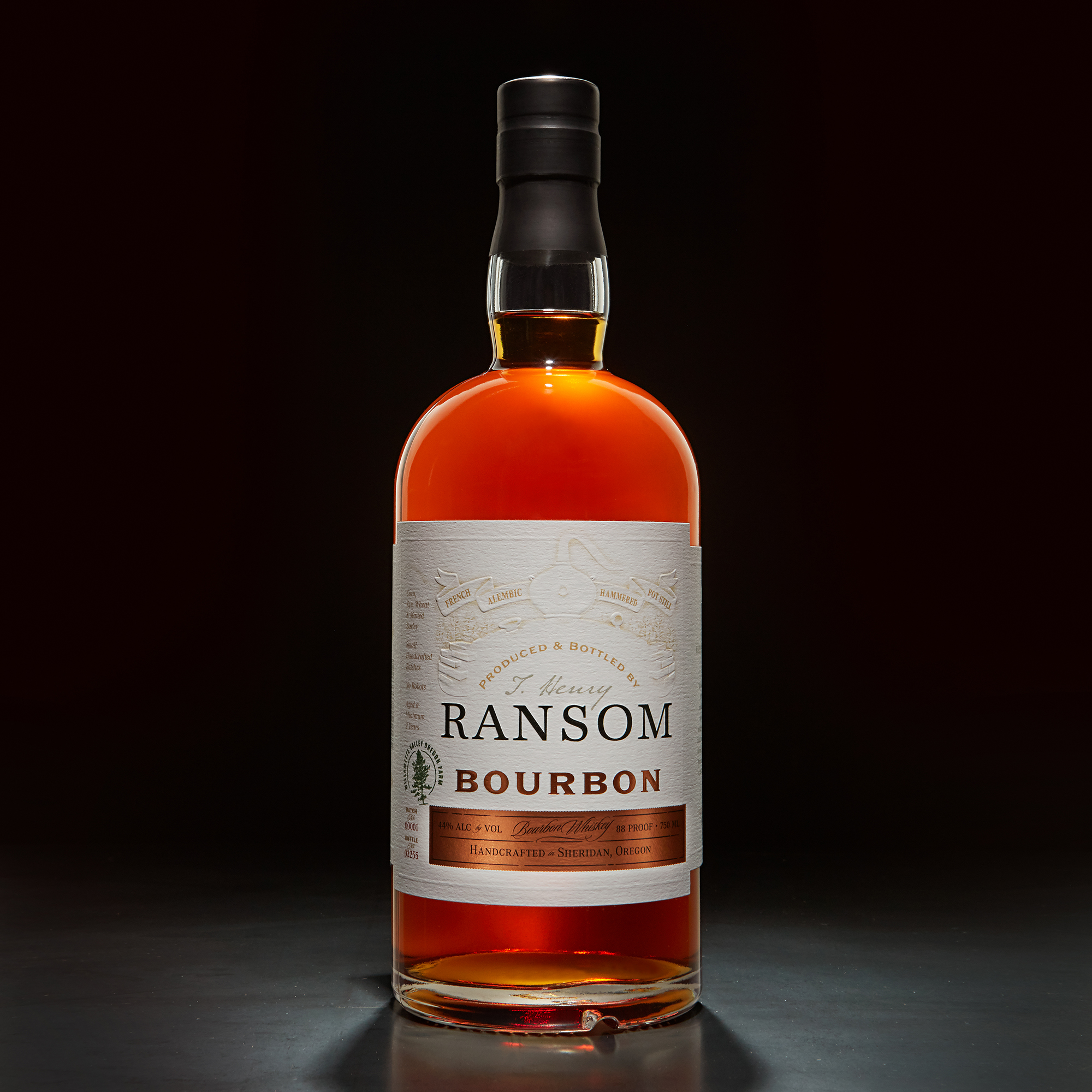 Bottle of Ransom Bourbon on a black background.